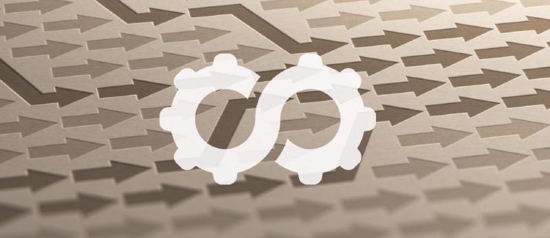 White DevOps infinity gear symbol over a background of paper arrows pointing in different directions